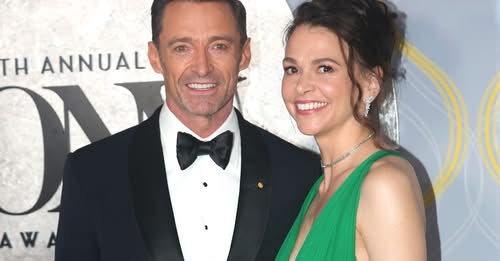 Hugh Jackman and Sutton Foster share a kiss before saying goodbye